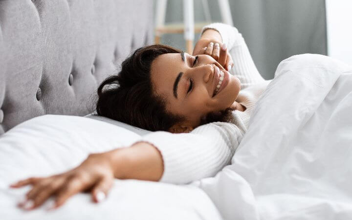 women waking up in bed